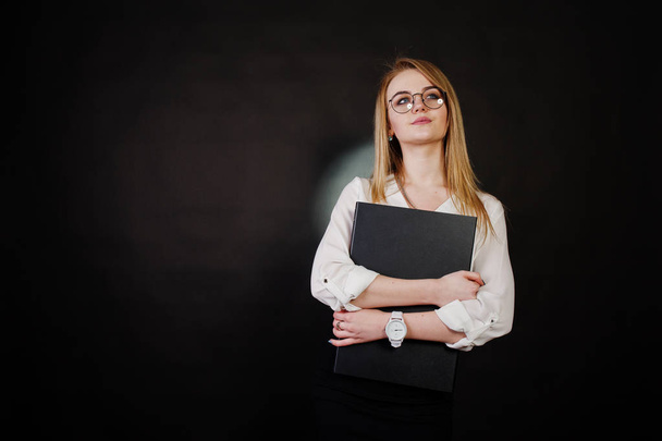Studio portrait of blonde businesswoman in glasses, white blouse - Фото, изображение