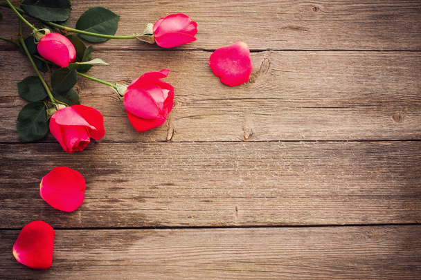 Roses on wooden background - Photo, image