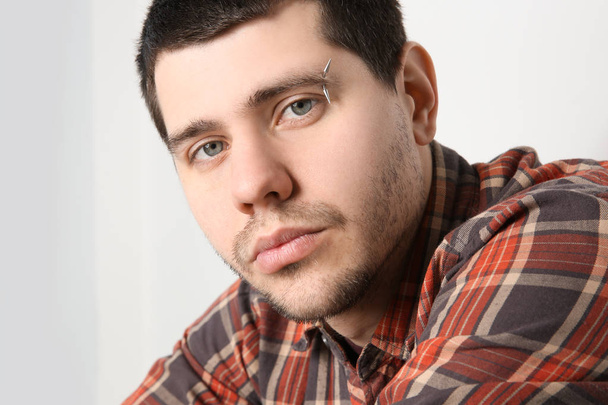 young man with pierced eyebrow - Fotó, kép