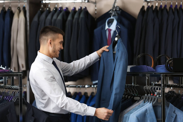 man choosing elegant suit - Zdjęcie, obraz