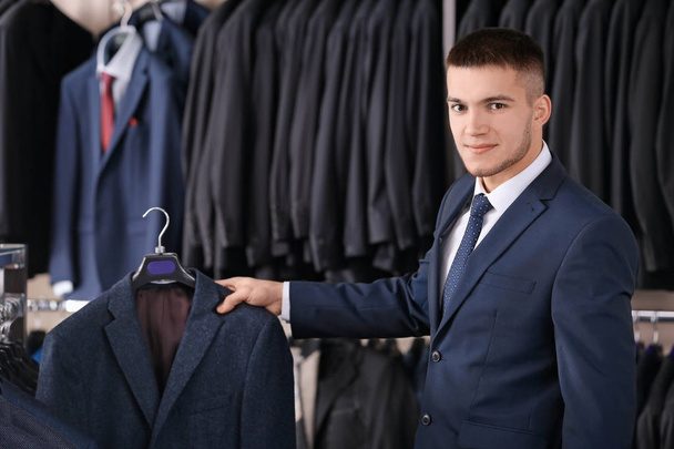 man choosing elegant suit - Фото, изображение