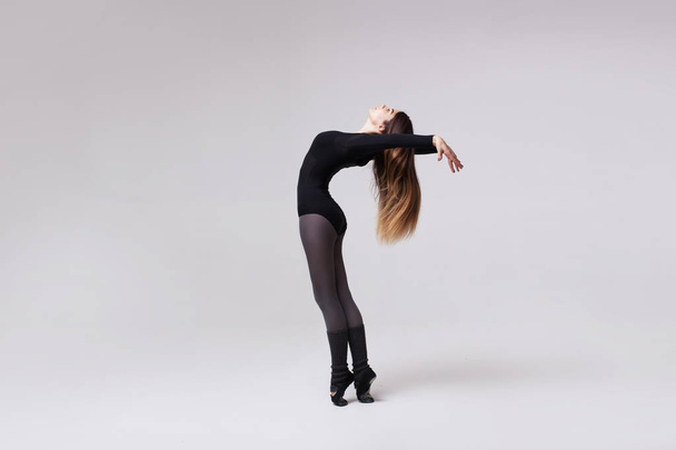 young beautiful dancer in black swimsuit - Foto, Imagem