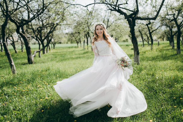 young  beautiful  bride posing  outdoors - Photo, image