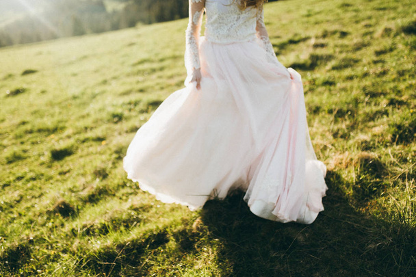 Delicate beautiful  bride posing outdoors - Fotó, kép