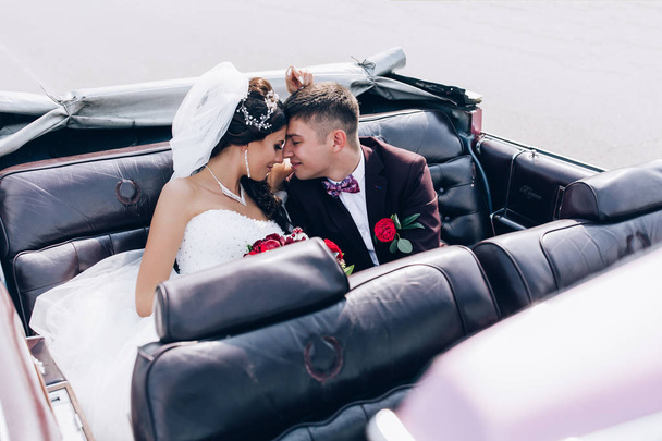 A newlyweds trip in the car. - Фото, изображение