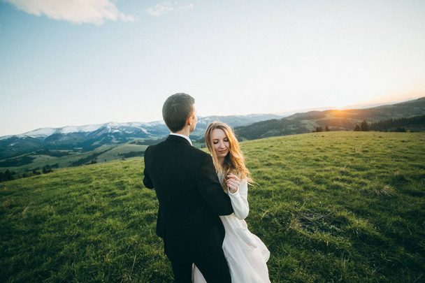 young couple of newlyweds embracing outdoors - Foto, afbeelding