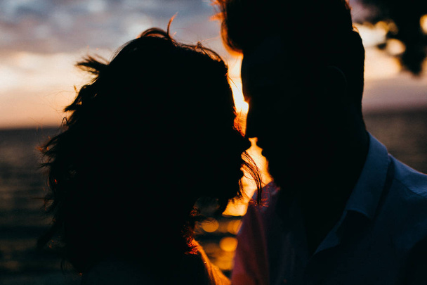  young couple of newlyweds by the lake at sunset - 写真・画像