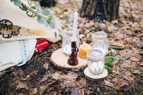 beautiful rustic decoration with candles  in the forest - 写真・画像