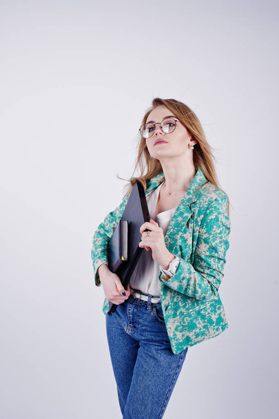 Stylish blonde girl in jacket and jeans at glasses with notebook - Photo, image