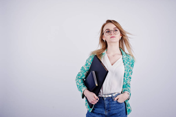 Stylish blonde girl in jacket and jeans at glasses with notebook - Fotoğraf, Görsel