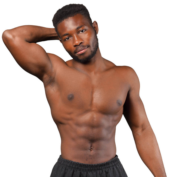 Handsome guy showing his strong torso isolated on white background - Fotó, kép