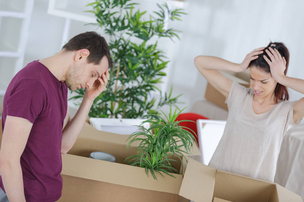 young couple is tired because of packing up - Photo, image