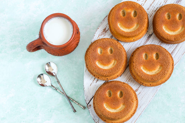 Funny homemade cupcakes in form of smiling face  - Photo, Image