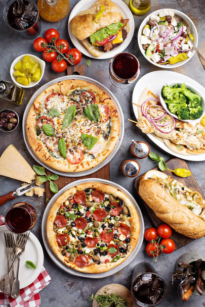 Big dinner with pizza and sandwiches - Fotó, kép