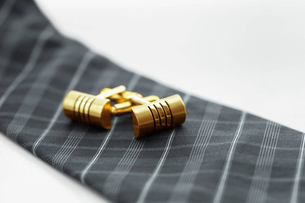tie and cufflinks on the table. - Foto, afbeelding
