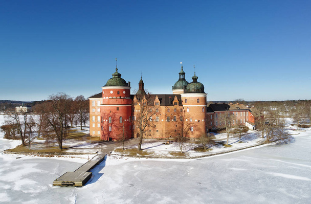 Aerial view during the winter season of the Gripsholm castle located in Mariefred in the Swedish province of Sodermanland. Construction started 1537 and was completed 1709. - Photo, Image
