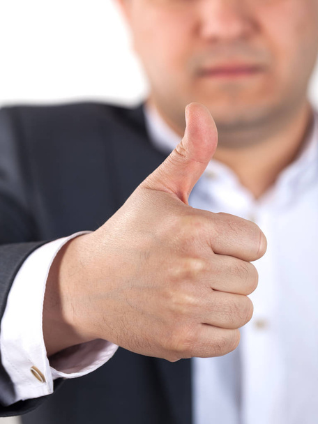 Happy businessman with thumbs up gesture, isolated on white - Foto, Bild