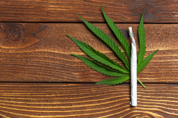 Close up of medical Marijuana on wooden background - Photo, image