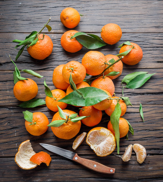 Ripe tangerines on wooden table.  - Fotó, kép