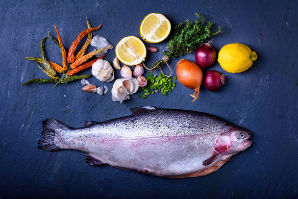 Fresh salmon with cooking ingredients. Raw fish  - Zdjęcie, obraz