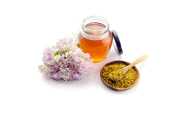 El frasco con miel y polen de flores
 - Foto, imagen