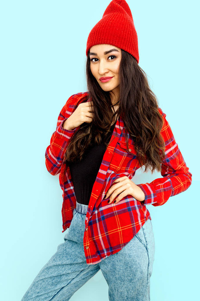 Pretty brunette Model Urban Casual Look.  Checkered shirt, jeans - Photo, image