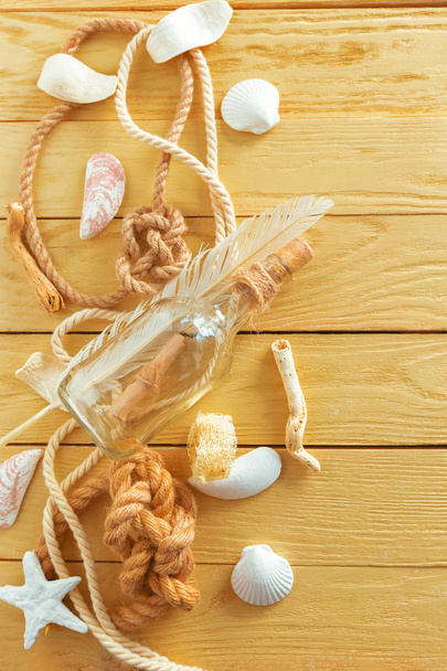 Idea of interior decoration with seashells and glass bottle - Foto, afbeelding