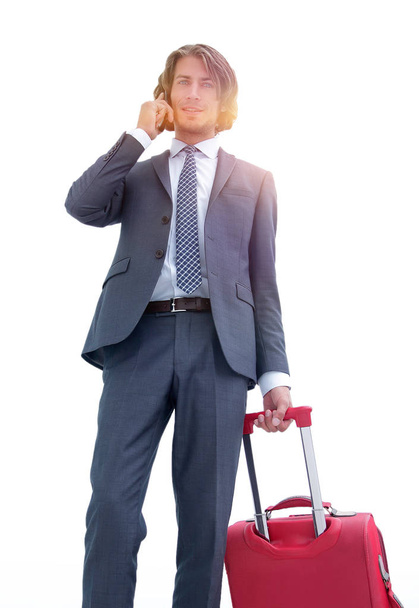businessman with travel suitcase talking on mobile - Fotó, kép