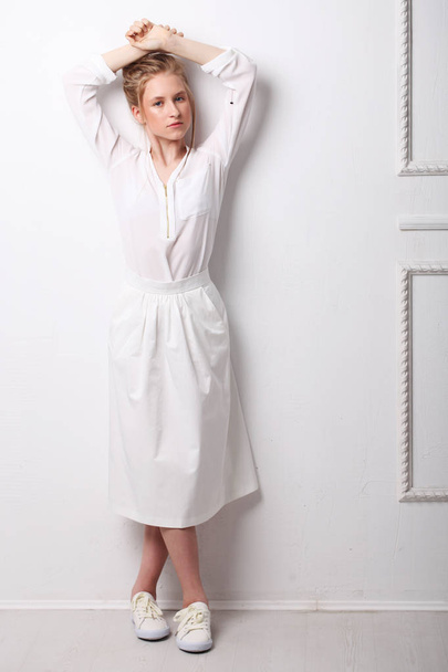 Beautiful Cute fashion girl teenage in white clothes on white background. Childrens fashion. - Foto, imagen