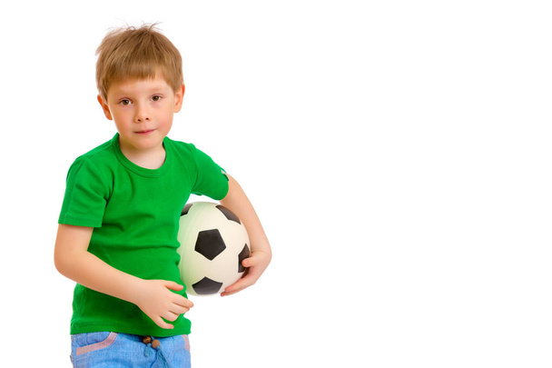 Little boy is playing with a soccer ball. - Zdjęcie, obraz