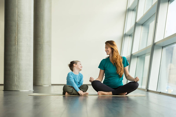 pregnant woman doing prenatal yoga with child - Zdjęcie, obraz