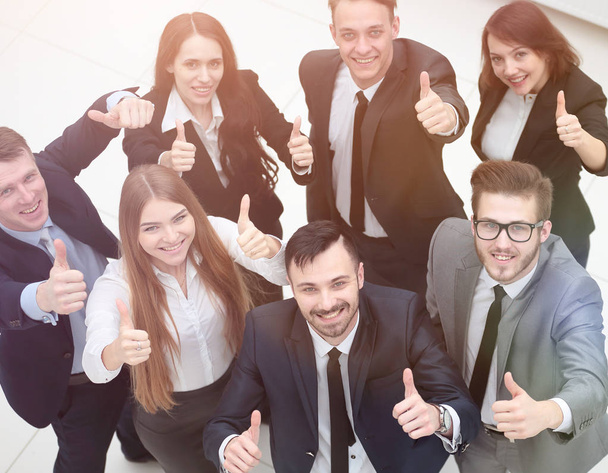successful business team holding up a thumbs up - Photo, image