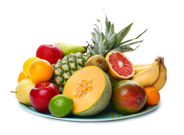 Plate with fresh tropical fruits on white background - Photo, Image