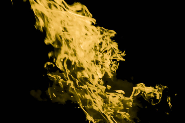 Yellow flame. Fire. Burning of rice straw at night. - Фото, изображение
