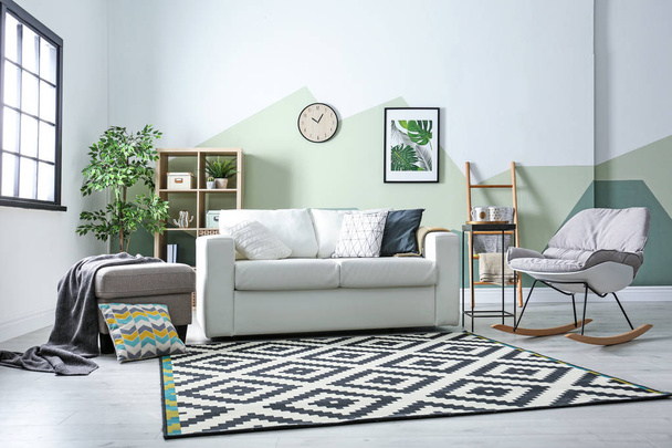 Stylish living room interior with comfortable sofa - Фото, зображення