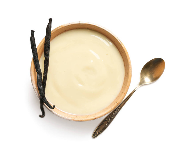 Vanilla pudding and sticks on white background - Fotoğraf, Görsel