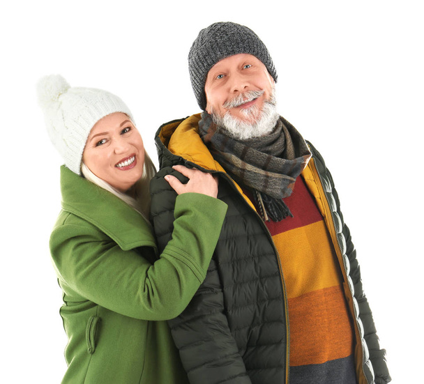 Mature couple in warm clothing on white background. Ready for winter vacation - Φωτογραφία, εικόνα