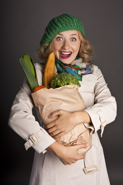 Positive woman with the package useful food - Φωτογραφία, εικόνα