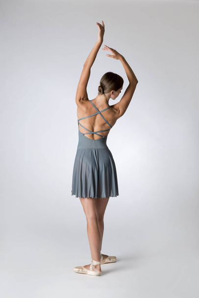 Back View of Ballerina in Crossed Open Back Gray Leotard - Φωτογραφία, εικόνα