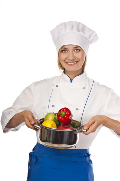 Chef in hotel or restaurant kitchen cooking - Foto, afbeelding
