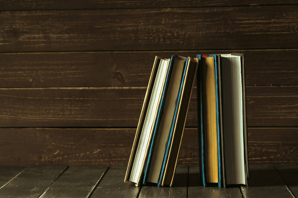 Books close up on old wooden table - Photo, image