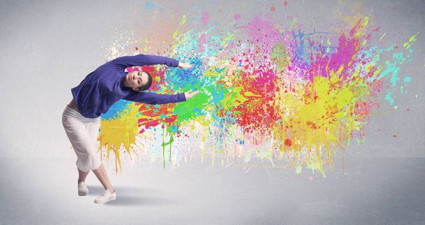 Young colorful street dancer with paint splash - Фото, зображення