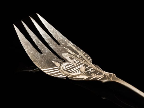Fish fork made of silver with engravings - Foto, Imagem