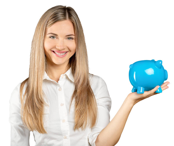Happy young woman with a money box isolated on white - Foto, imagen