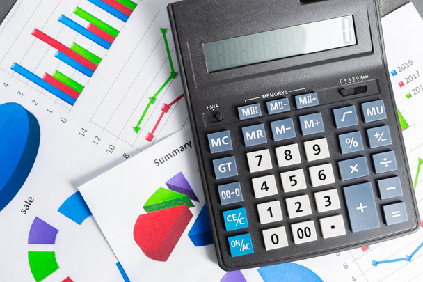 Calculator on business table. Checking accounting report concept - Photo, Image