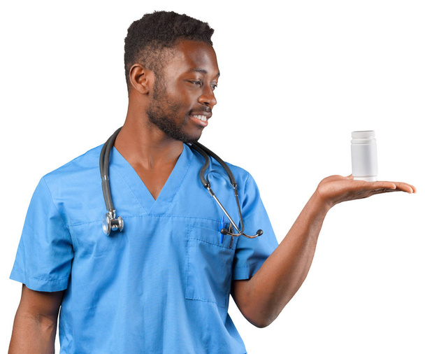 friendly african american pharmacist holding pills - Zdjęcie, obraz