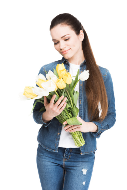 beautiful young woman with bouquet of tulips, isolated on white - Foto, imagen