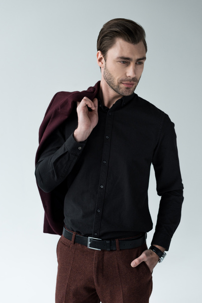 handsome man posing with trendy jacket, isolated on grey - Zdjęcie, obraz