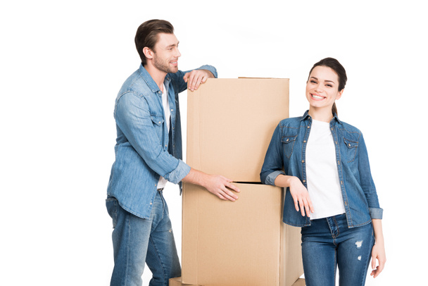 moving couple with carton boxes, isolated on white - Photo, Image