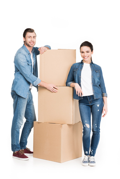 young couple with cardboard moving boxes, isolated on white - Foto, Imagem